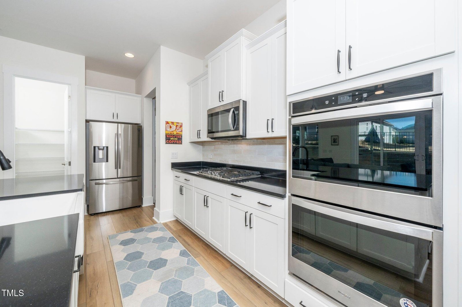 Modern kitchen with double ovens in 55 and over friendly neighborhood